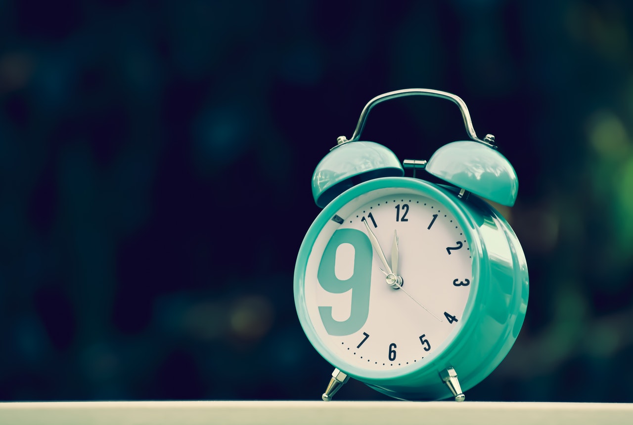 Image of a blue clock showing the need to have a sense of urgency in both life and digital marketing.